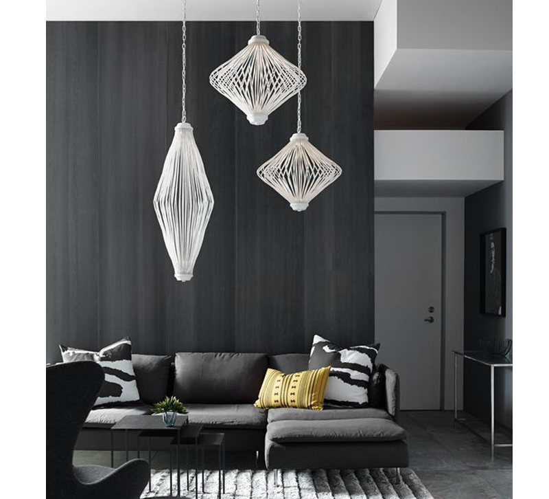 Living room with gray sofa and three white pendants hanging above