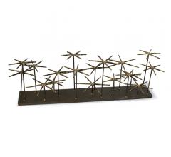 Andromed tabletop accessory with 16 decorative spikes on a slab of iron from Regina Andrew Design