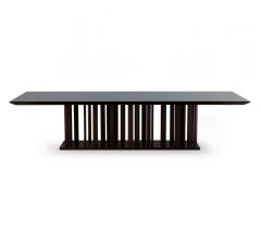 Le Bois Dining Table with a black top and deep brown base from Christopher Guy