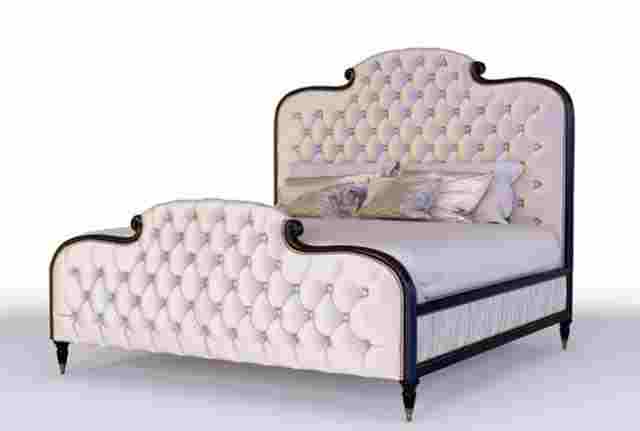 cream upholstered bed